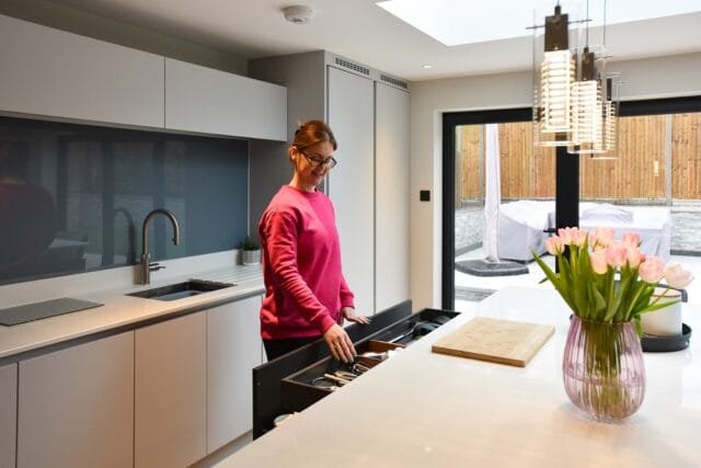 Handleless supermatt kitchen in graphite and light grey