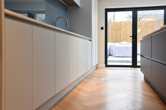 Handleless supermatt kitchen in graphite and light grey