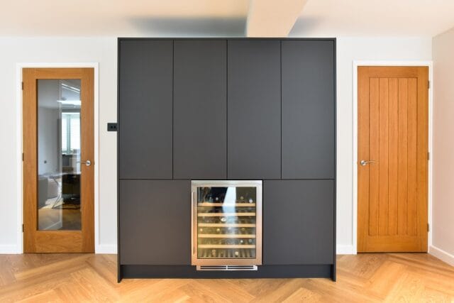 Handleless supermatt kitchen in graphite and light grey