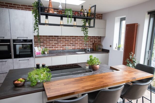 Modern two tone kitchen in light concrete and light pebble