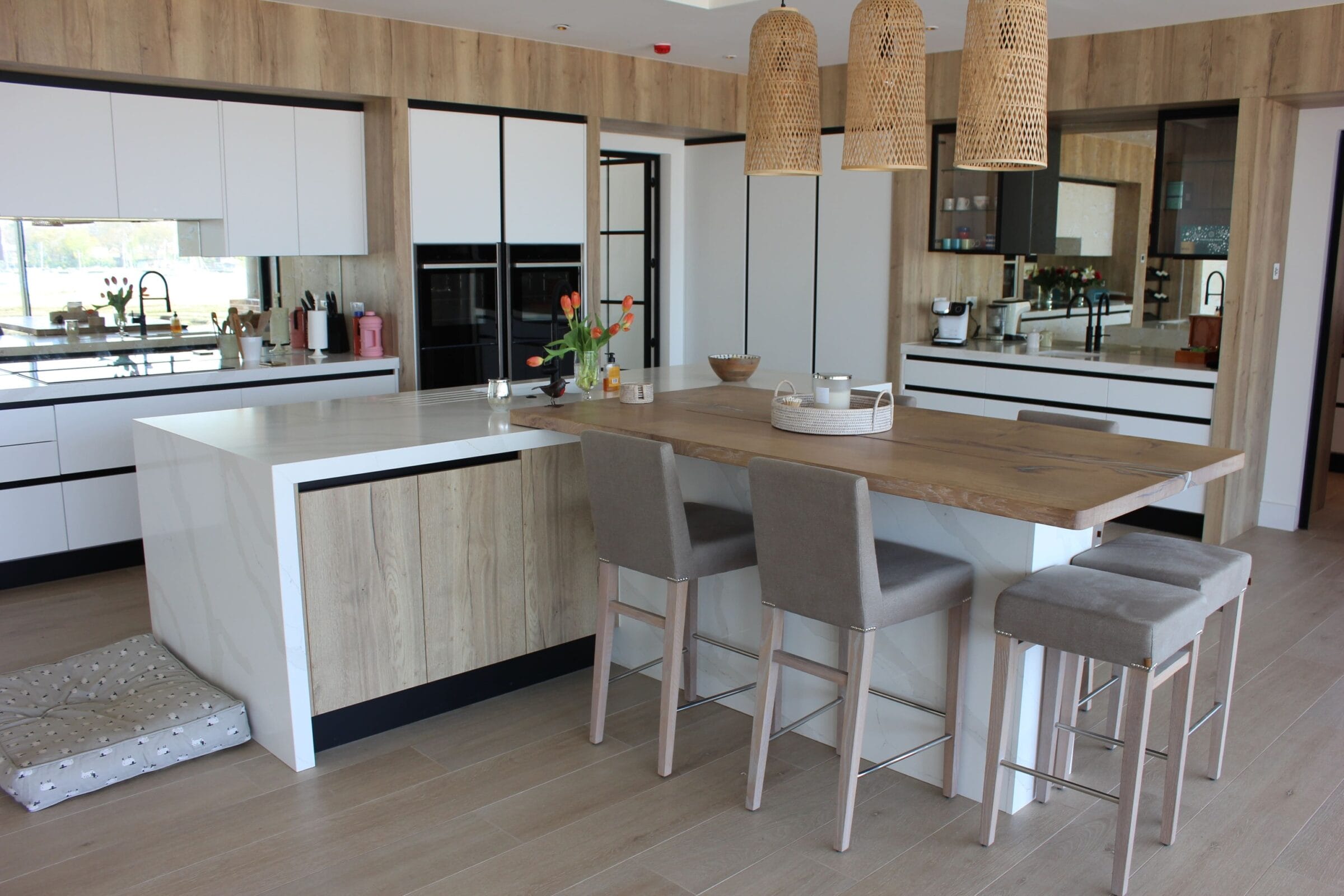 Contemporary Kitchen Living kitchen with white and wood cabinetry, island seating, breakfast bar and woven pendant lights