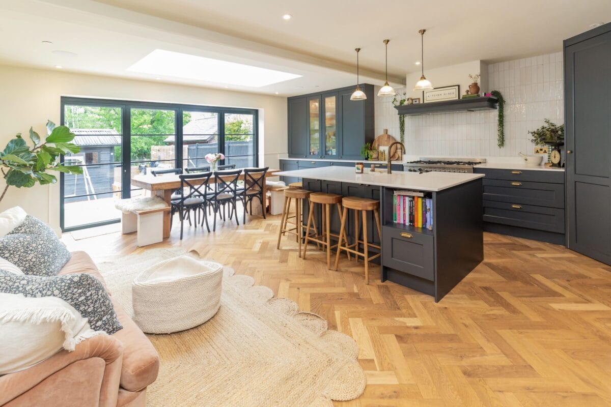 Open-plan kitchen with island, dining area and living space in a modern Hampshire home